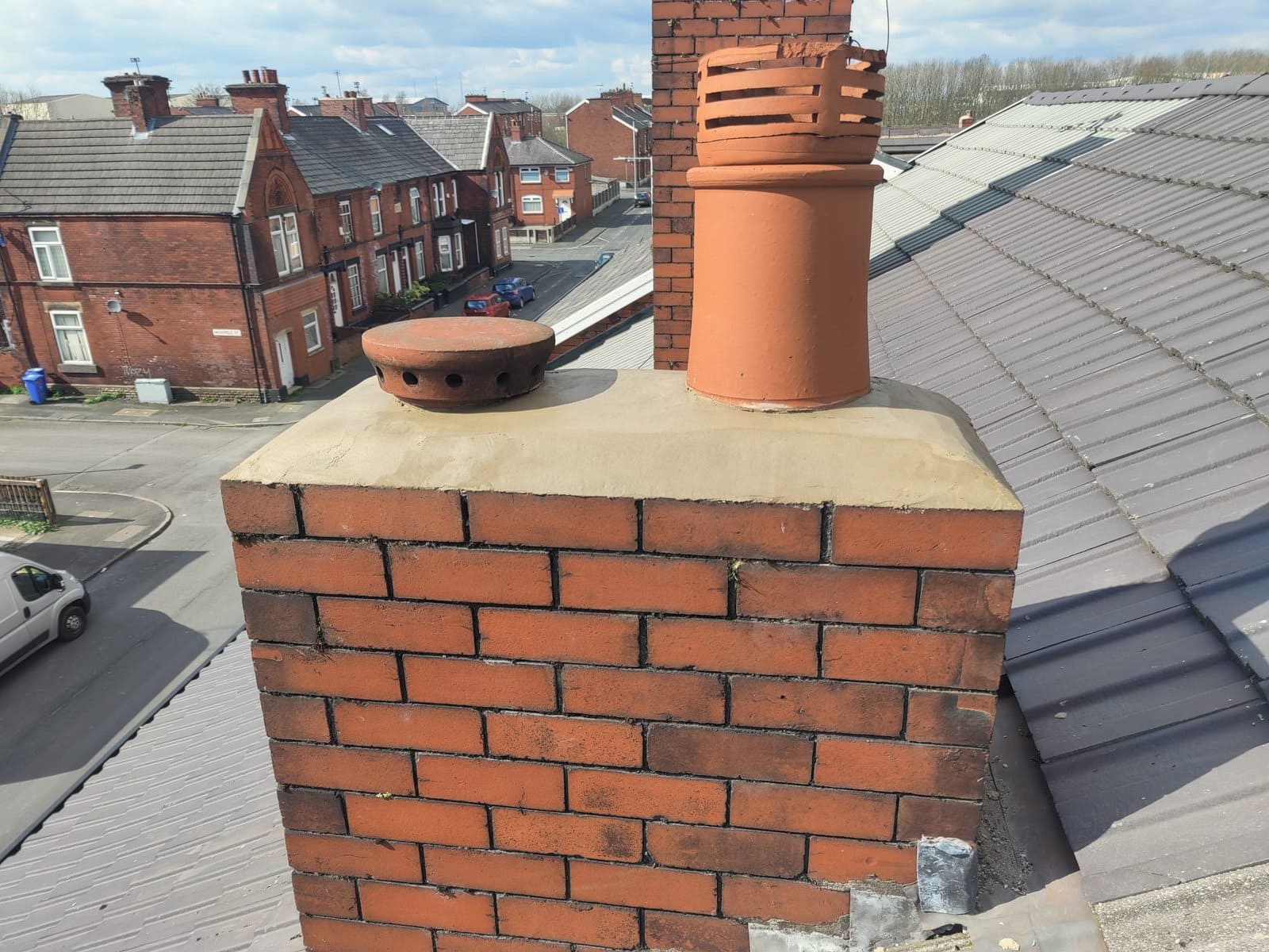 Top of a chimney flaunched by dm roofing in manchester